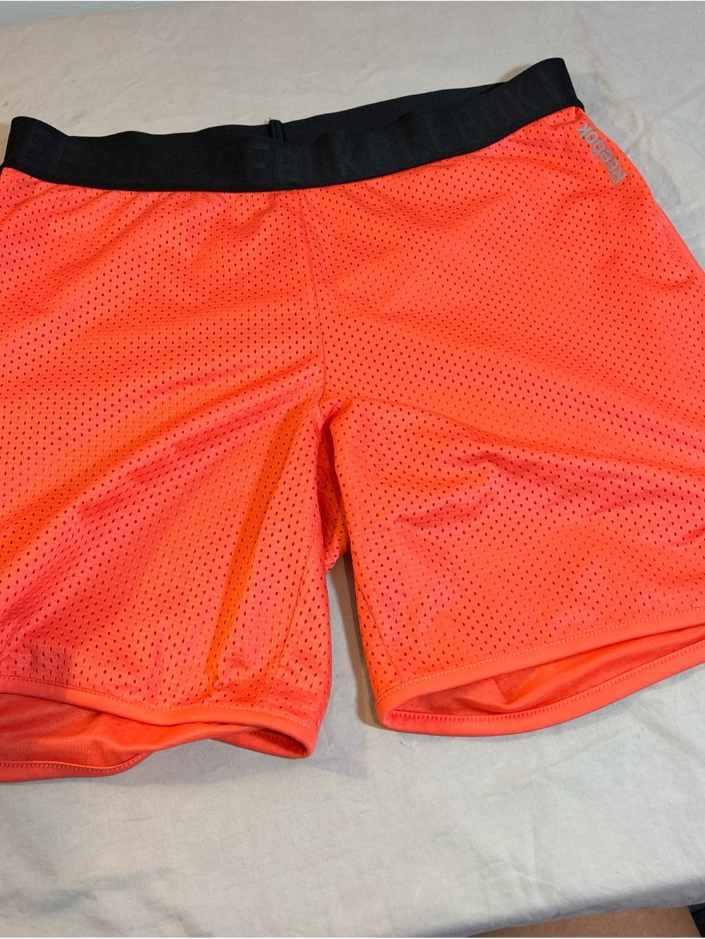 Reebok Women’s Bright Orange Mesh Athletic Shorts with Black Waistband 706